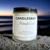 A handcrafted scented soy blend candle at our store. The candle is
