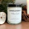 A handcrafted scented soy blend candle at our store. The candle is