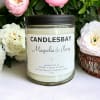 A handcrafted scented soy blend candle at our store. The candle is