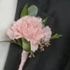Boutonni&egrave;re to place on attire to match evening attire.