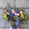 A show stopping arrangement filled with a variety of brightly colored blooms.