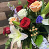 The &quot;Harmony Hues&quot; bouquet is a beautifully balanced arrangement featuring red, white