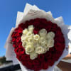 A total of 65 roses, white roses to create the heart in