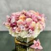 A beautiful array mixed flowers that include Roses, Orchids and Hydrangeas in
