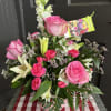 Pink Roses and White Lilies accented with pink and white flowers