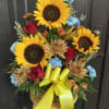 Show your sympathy with a bouquet of Sunflowers, Carnations, and Red Roses