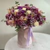 Roses, orchids and mixed flowers arranged in a box. (any color of