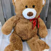 A large brown teddy bear is the perfect gift for a loved