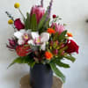 A stunning tropical floral arrangement that transports you to the islands, where
