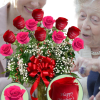 12 Roses Arranged in a Vase with greens, filler, and bow.
(6 Red