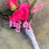 Select this bright boutonniere consisting of barbie pink roses and pink filler