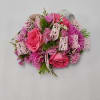 Select this adorably pink corsage featuring spray roses, cornflower, statice, and misty.
