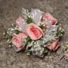 Select this corsage consisting of 5 pale pink spray roses with babies