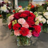 This arrangement contains spray daisies and spray roses. This is a great
