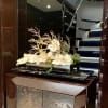 Silk orchids with golden driftwood in a vase. Costom made. Beautiful decor