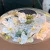 Silk orchids with stones and succulents in clear vase. Custom made. Beautiful