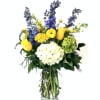Fresh, clean, and breezy. This arrangement includes yellow, blue, and white mix