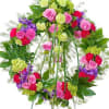 This beautiful wreath with a combination of pink and purple flowers will