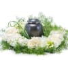 White and cream blooms surround the urn of your loved one.

