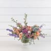 Beautiful blend of tones in this chic arrangement in a footed compote.
