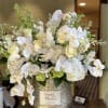 Large size of arrangement in a gold vase with orchids.A bouquet that