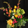 Colorful roses, spray roses and accent flowers that will be specific to