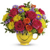Happiness, delivered! Colorful roses in a cheerful ceramic mug are the quickest