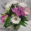 Small vase filled with lavender and white daisies, pink mini carnations with