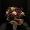 Tranquil whites roses, hot pink and soft pink carnations that mingle together
