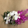 A beautiful orchid corsage perfect for your next prom, graduation or even