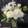 Pristine all white premium flowers including Lilies, Hydrangea, Roses, China Mums &amp;