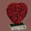 Heart filled with roses (any color) with moss filled stand