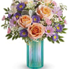 Peach roses, pink alstroemeria, miniature pink carnations, lavender matsumoto asters and lavender