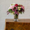 For this exquisite floral arrangement, envision a captivating blend of peonies, lilacs