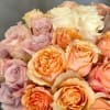 A sensational floral presentation arranged in a white vase. Luscious pastels featuring