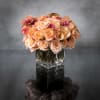 Bold and dynamic, this stunning display of Cherry Brandy roses and garden
