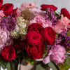 Immerse yourself in a world of seduction with our enchanting floral creation.