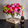 The floral arrangement is a sight to behold, showcasing large-headed pink peonies