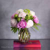 Available for Same-Day Delivery!

Nestled within a sleek vase, the Ethereal Elegance arrangement
