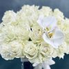This arrangement has over 36 Blooms of pale green white Roses accented