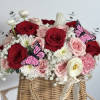 Nestled within this chic handbag are enchanting flowers bursting with color and