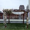 Beautiful white, pink and blush roses, carnations and other flowers huppah decor