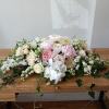 Beautiful white, pink and blush flowers sweetheart table centerpiece