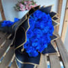 The bouquet of 24 Blue Roses wrapped in black paper and a