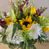 Sunflowers, yellow roses, purple snapdragon, white hydrangeas, white mums, solidago, pink lilies