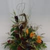 This arrangement including wood, willow, pods, berries, cones, and more is the