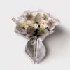 Picture an elegant ivory bouquet, exuding timeless beauty and sophistication. This stunning