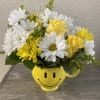 Yellow roses, yellow daisies, white daisies, solidago in a happy face mug