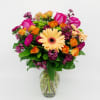 A very pretty, bright and fun arrangement of orange, pink, and green