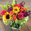Beautiful arrangement of pink sunflowers and foliage
